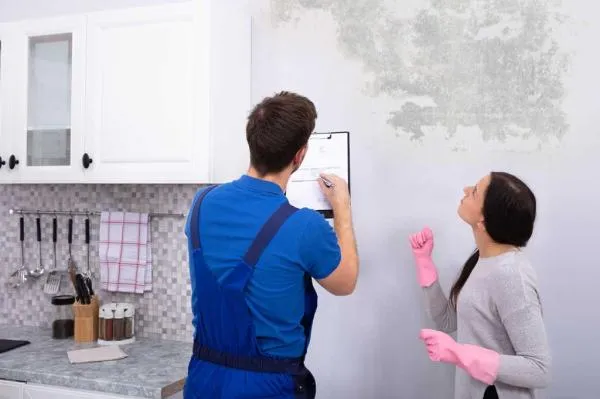 Mold inspector reviewing findings with a San Diego homeowner
