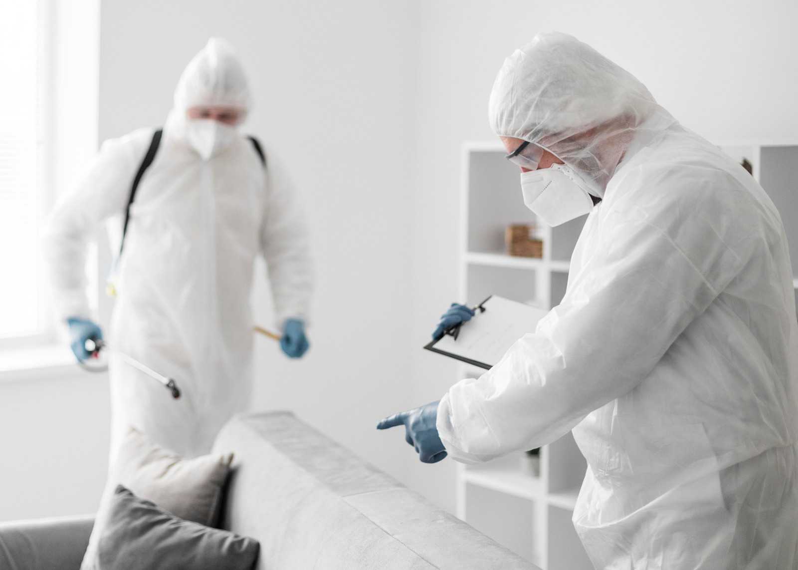 Mold inspector documenting a moisture-damaged wall in a San Diego home